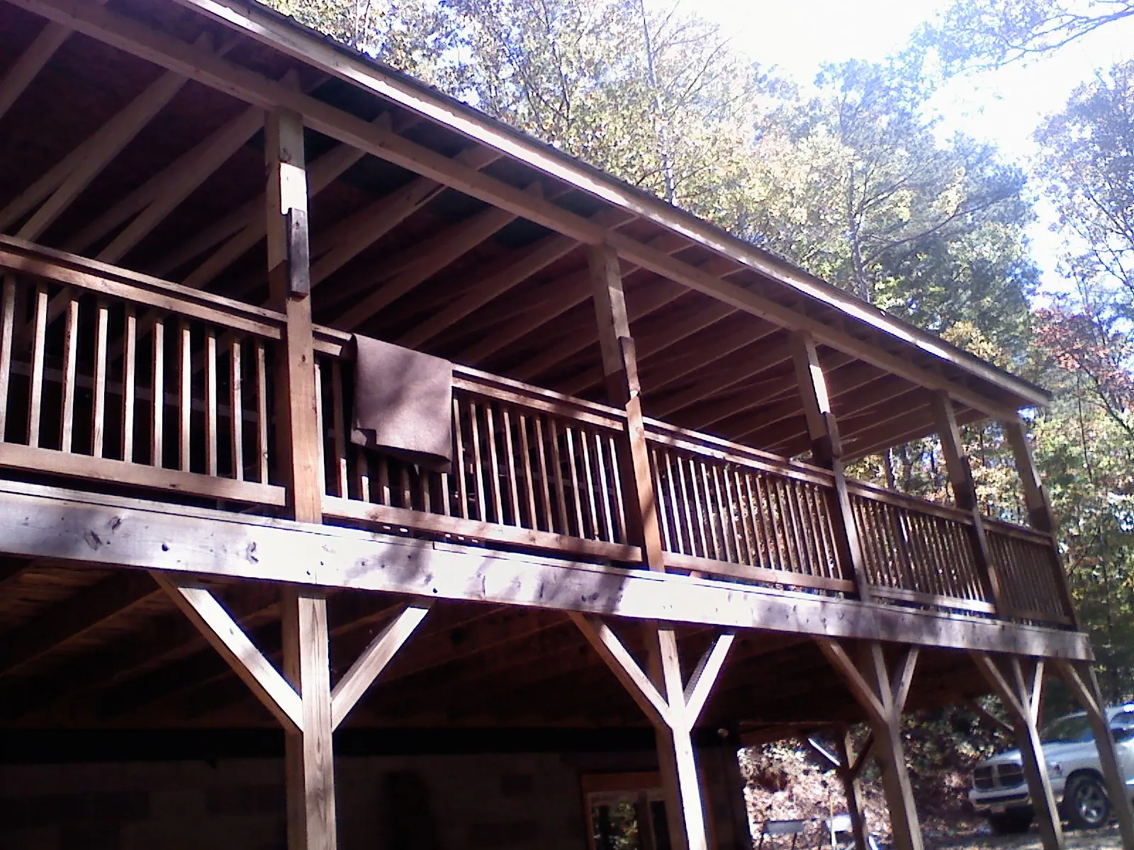 Timber framing under a new elevated porch and deck — Roof Leak Repair in Lake Arrowhead by Roofing Brothers